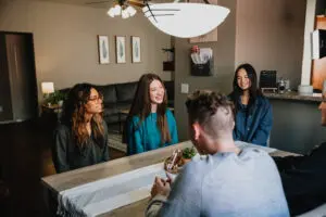 a small group meeting in a dining room